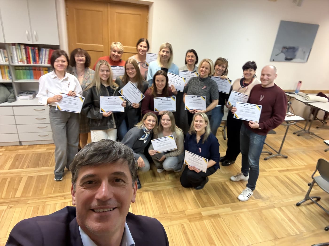 Teachers in Talsi, Latvia, holding their certificate after completed workshops by Platform21 Erasmus+ Invited Expert on AI and innovative methods of teaching
